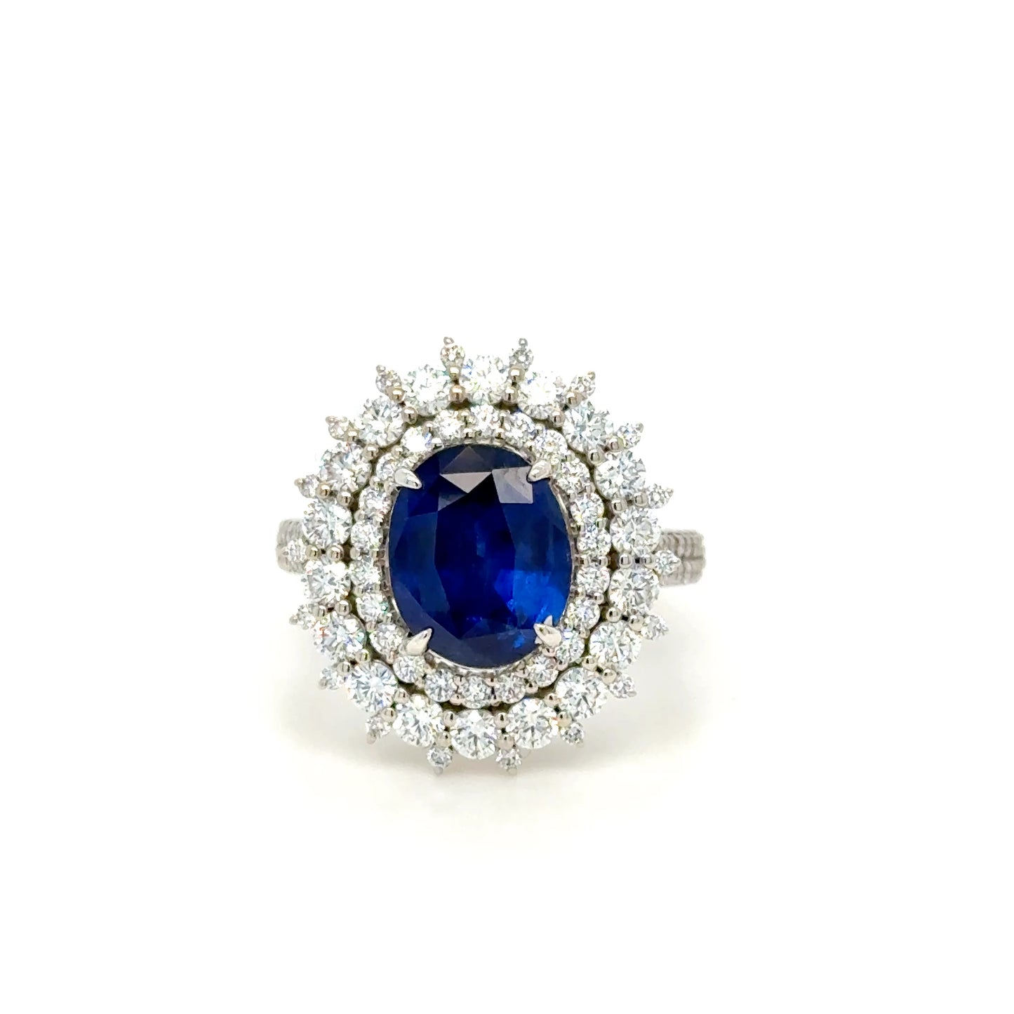 18k gold 3.95ct Royal Blue Oval Ceylon Sapphire & diamond Cluster Ring